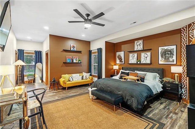 bedroom with hardwood / wood-style floors and ceiling fan