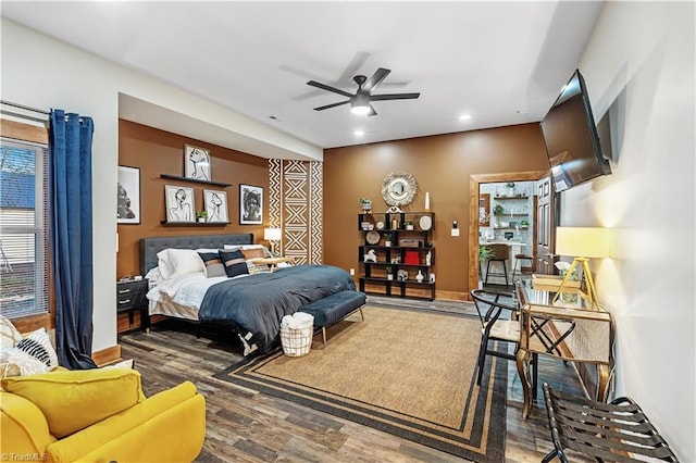 bedroom featuring dark hardwood / wood-style floors and ceiling fan