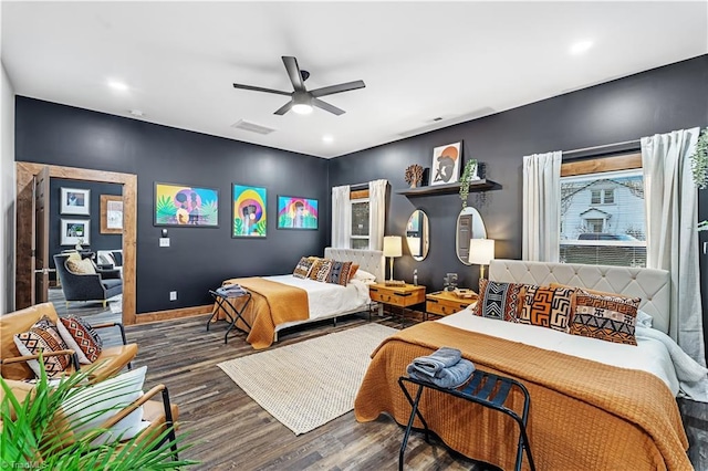 bedroom featuring dark hardwood / wood-style flooring and ceiling fan