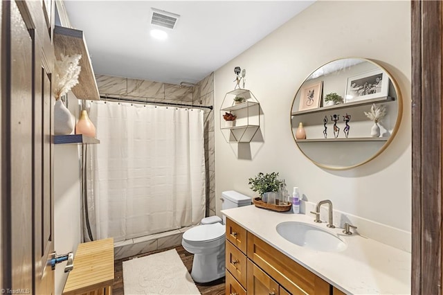 bathroom with a shower with curtain, vanity, and toilet