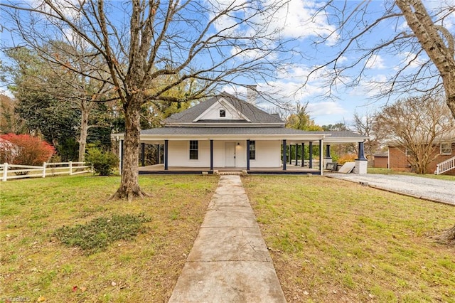 farmhouse inspired home featuring a front lawn and a porch