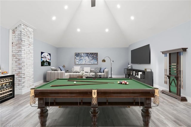 recreation room with lofted ceiling, billiards, and light hardwood / wood-style flooring