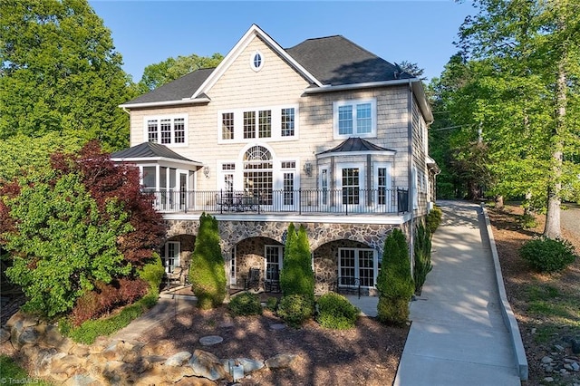 338 Fairfield Ct, Mount Gilead, NC 27306 - view of front facade featuring a standing seam roof, stone siding, and metal roof