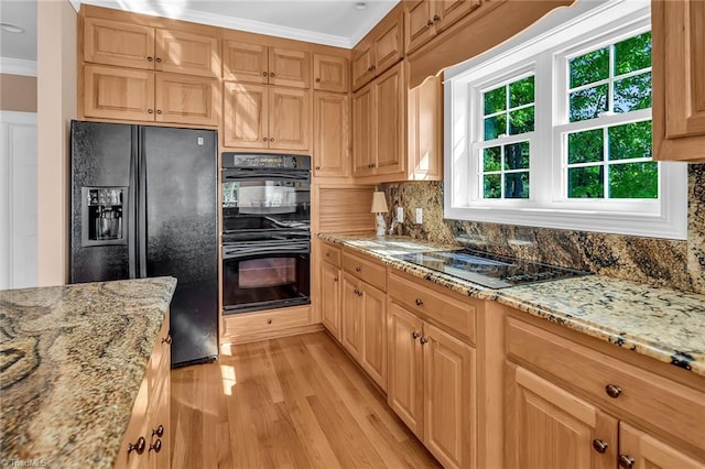 338 Fairfield Ct, Mount Gilead, NC 27306 - kitchen with black appliances, crown molding, light wood-style flooring, tasteful backsplash, and light stone countertops