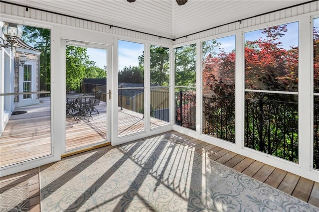 338 Fairfield Ct, Mount Gilead, NC 27306 - unfurnished sunroom featuring outdoor dining area, ceiling fan, and a wooden deck