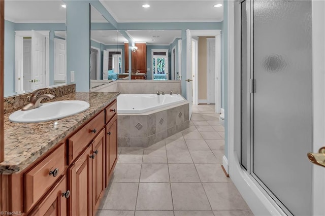338 Fairfield Ct, Mount Gilead, NC 27306 - full bathroom featuring ornamental molding, vanity, a shower stall, a whirlpool tub, and tile patterned floors