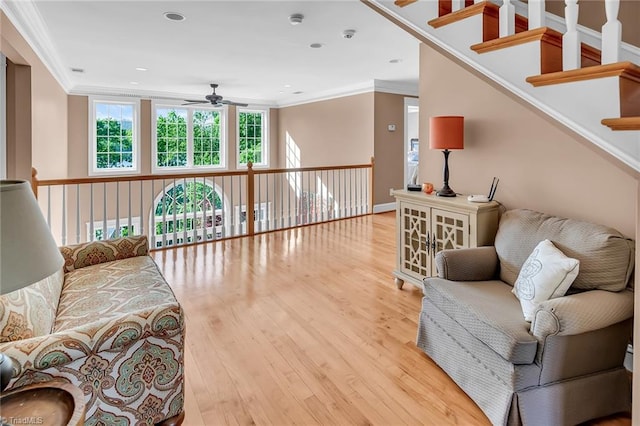 338 Fairfield Ct, Mount Gilead, NC 27306 - living area featuring a ceiling fan, crown molding, wood finished floors, and baseboards