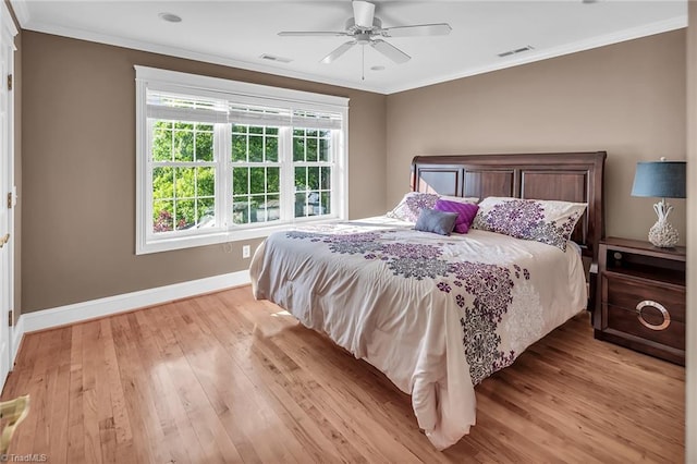 338 Fairfield Ct, Mount Gilead, NC 27306 - bedroom featuring light wood finished floors, baseboards, crown molding, and a ceiling fan