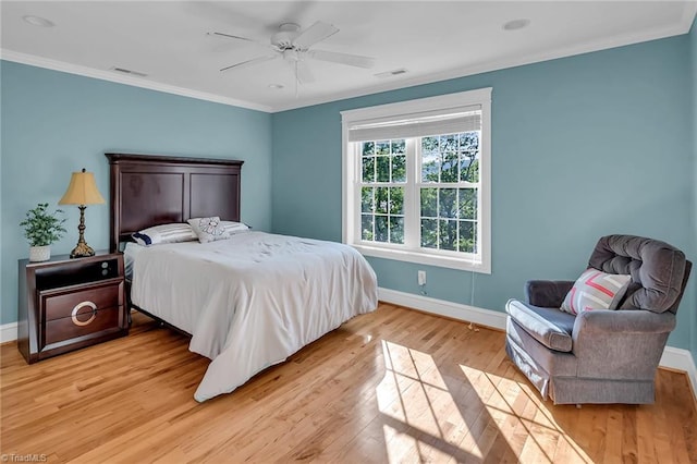 338 Fairfield Ct, Mount Gilead, NC 27306 - bedroom featuring baseboards, ornamental molding, light wood-style flooring, and ceiling fan