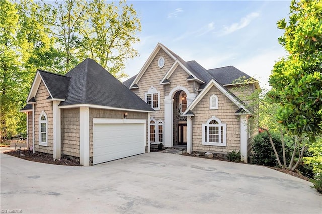 338 Fairfield Ct, Mount Gilead, NC 27306 - view of front facade with a garage, roof with shingles, and driveway