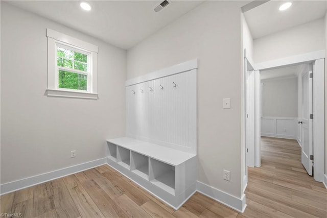 mudroom with light hardwood / wood-style floors