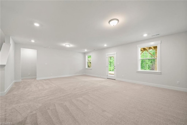 empty room with light colored carpet