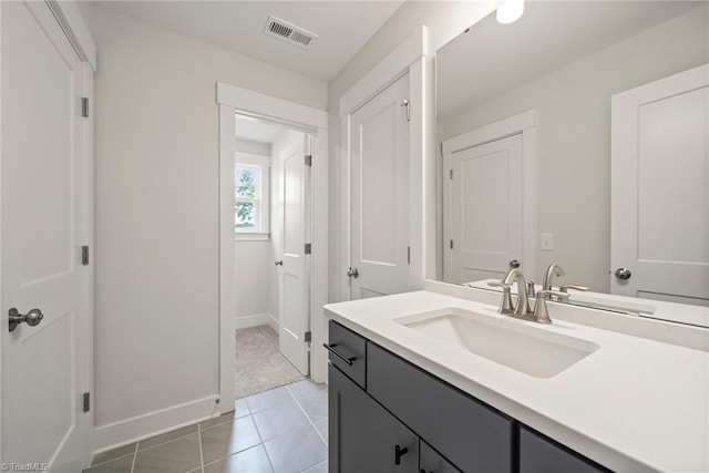 bathroom featuring tile patterned floors and vanity