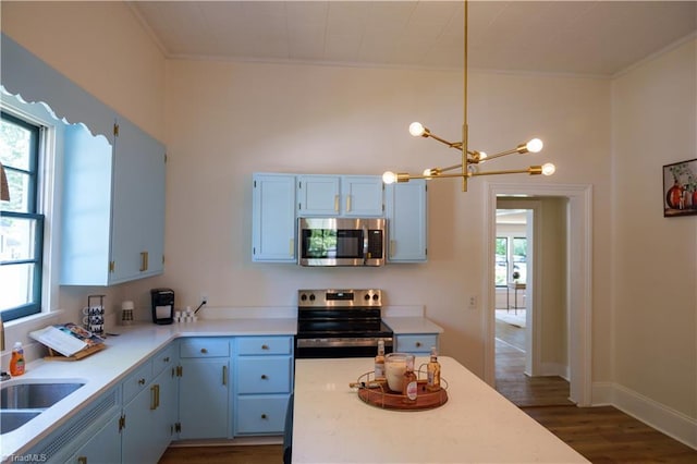 301 S Shaver St, Salisbury, NC 28144 - kitchen featuring stainless steel appliances, a chandelier, crown molding, and healthy amount of natural light