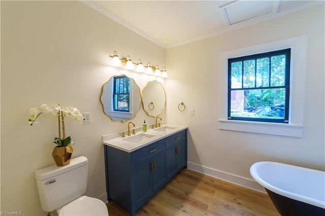 301 S Shaver St, Salisbury, NC 28144 - bathroom featuring double vanity, a freestanding bath, wood finished floors, and ornamental molding