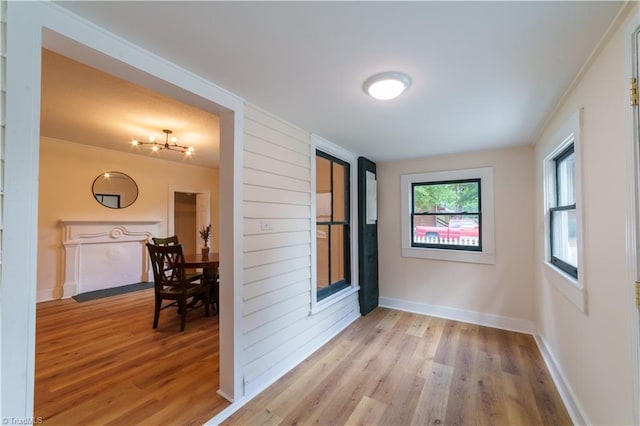 301 S Shaver St, Salisbury, NC 28144 - corridor featuring wood finished floors and a chandelier