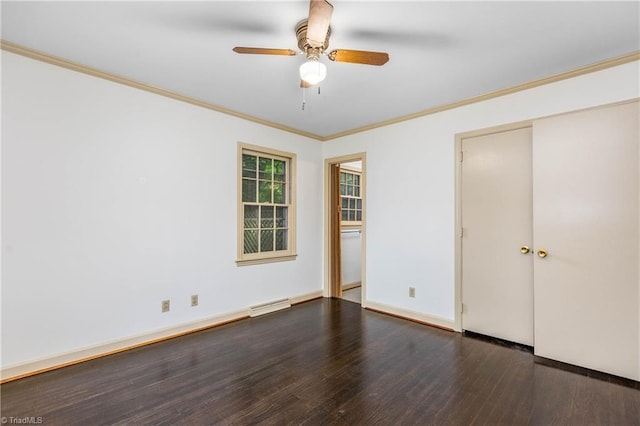 1400 Waybridge Ln, Winston-Salem, NC 27103 - unfurnished bedroom with wood finished floors, crown molding, a ceiling fan, baseboards, and a closet