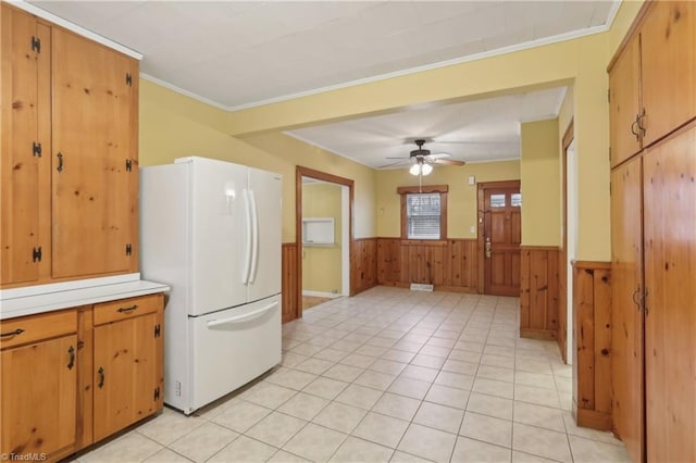 1146 Rogers Rd, Graham, NC 27253 - kitchen with freestanding refrigerator, a wainscoted wall, ornamental molding, light countertops, and ceiling fan
