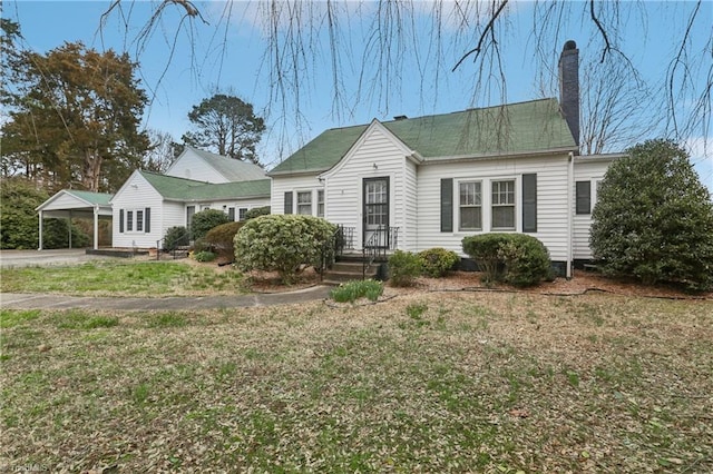 1146 Rogers Rd, Graham, NC 27253 - view of front of property with a chimney, a detached carport, and a front yard