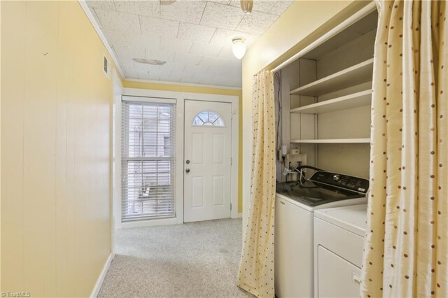 1146 Rogers Rd, Graham, NC 27253 - laundry room featuring baseboards, washing machine and dryer, light colored carpet, and ornamental molding