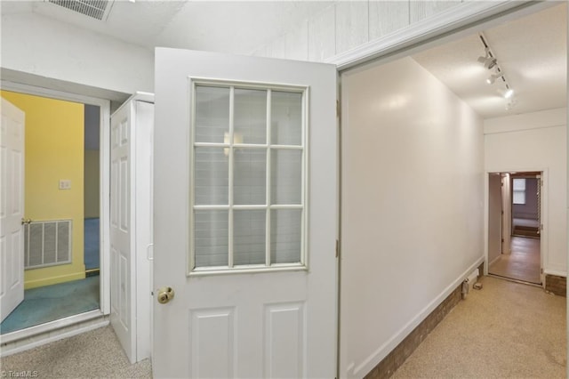 1146 Rogers Rd, Graham, NC 27253 - corridor with carpet flooring, track lighting, and baseboards