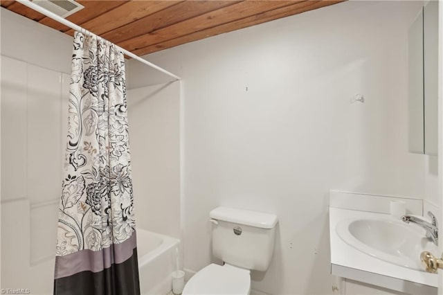 1146 Rogers Rd, Graham, NC 27253 - bathroom featuring vanity, toilet, and shower / bathtub combination with curtain