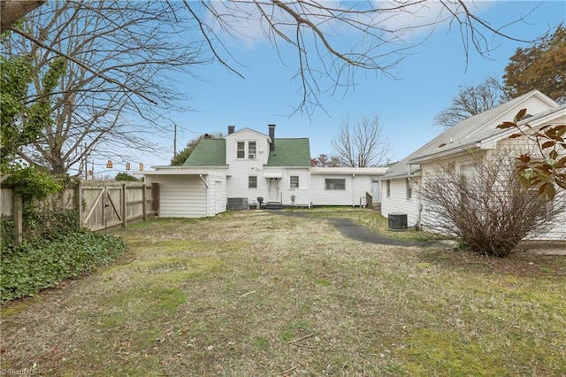 1146 Rogers Rd, Graham, NC 27253 - back of property with a chimney and central air condition unit