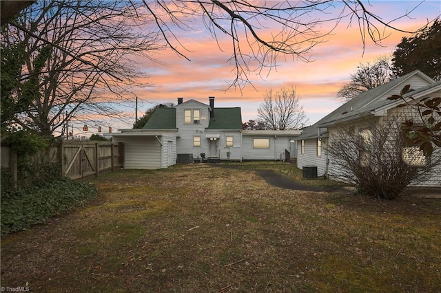 1146 Rogers Rd, Graham, NC 27253 - back of property with a chimney and central air condition unit