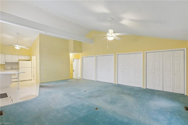 1146 Rogers Rd, Graham, NC 27253 - unfurnished living room featuring ceiling fan, high vaulted ceiling, light colored carpet, and baseboards