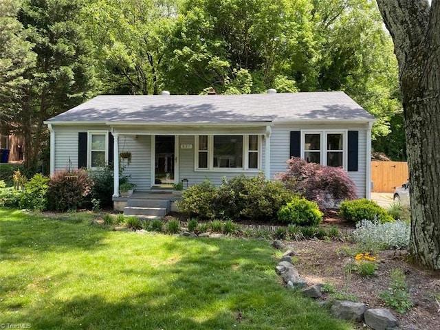 225 Harper St, Winston-Salem, NC 27104 - view of front of home with a front yard and covered porch
