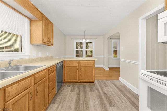 225 Harper St, Winston-Salem, NC 27104 - kitchen with white appliances, light wood finished floors, a peninsula, light countertops, and a chandelier