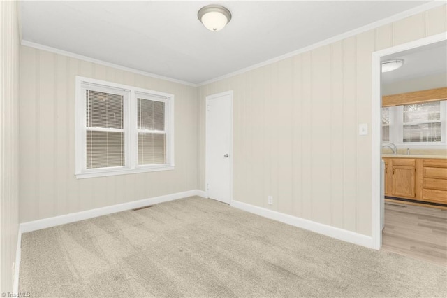 225 Harper St, Winston-Salem, NC 27104 - spare room with ornamental molding and light colored carpet