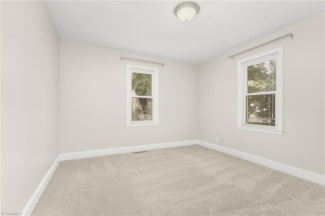 225 Harper St, Winston-Salem, NC 27104 - empty room featuring carpet flooring and plenty of natural light