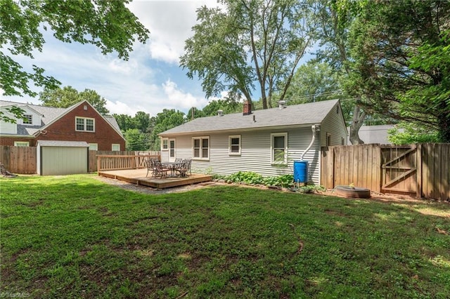 225 Harper St, Winston-Salem, NC 27104 - rear view of property featuring a fenced backyard, a deck, a chimney, and a gate