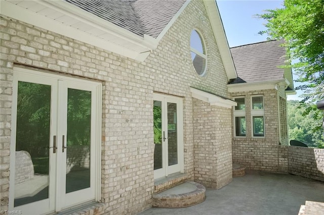 590 Turner Mountain Rd, Mount Airy, NC 27030 - view of side of home featuring french doors, brick siding, roof with shingles, and a patio