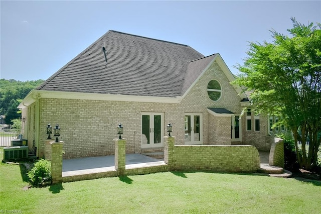 590 Turner Mountain Rd, Mount Airy, NC 27030 - rear view of house with french doors, roof with shingles, a lawn, and a patio