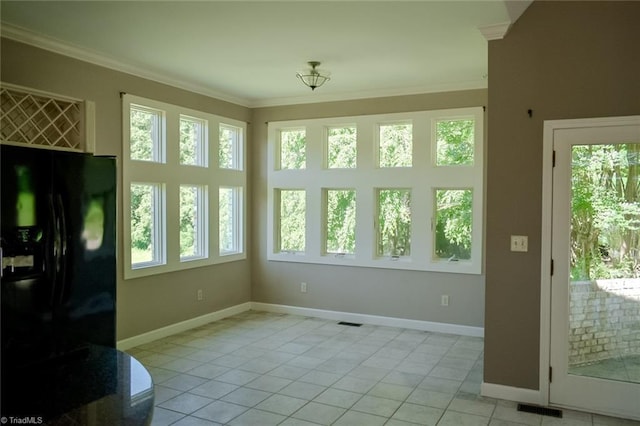 590 Turner Mountain Rd, Mount Airy, NC 27030 - unfurnished dining area featuring ornamental molding and light tile patterned floors