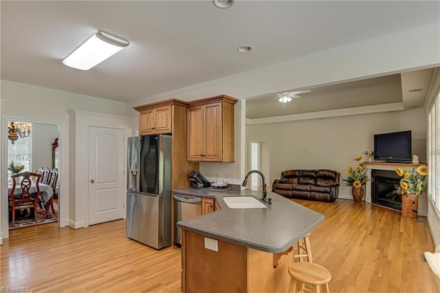 160 Serenity Pointe Dr, Kernersville, NC 27284 - kitchen featuring stainless steel appliances, a peninsula, dark countertops, a breakfast bar, and open floor plan