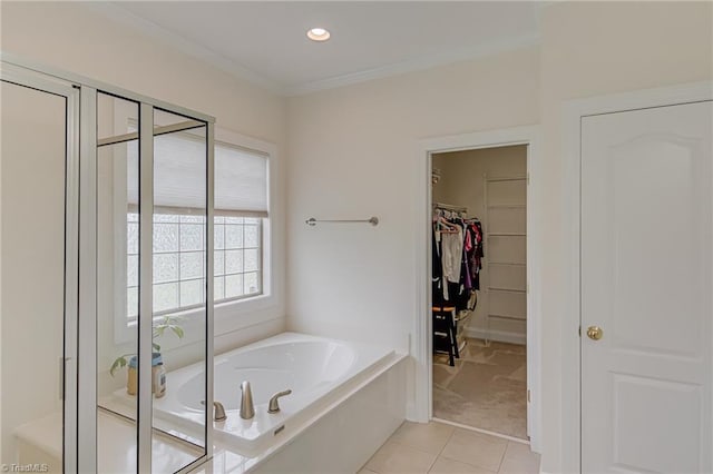 160 Serenity Pointe Dr, Kernersville, NC 27284 - bathroom with a garden tub, tile patterned flooring, a spacious closet, crown molding, and a shower stall