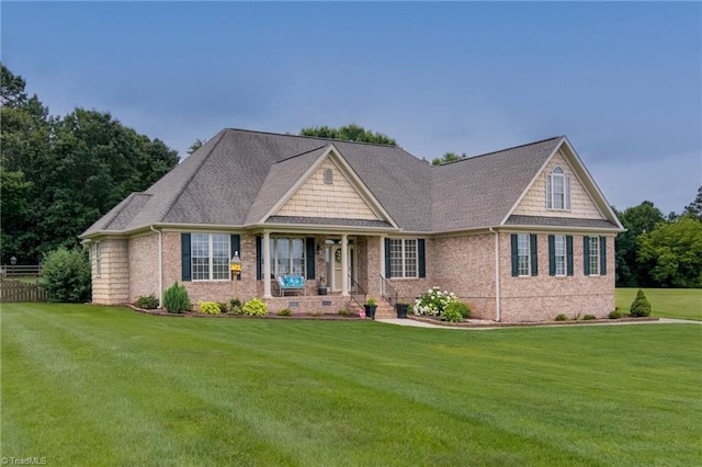 160 Serenity Pointe Dr, Kernersville, NC 27284 - craftsman-style home with a front yard, brick siding, a porch, a shingled roof, and crawl space