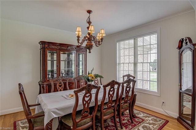 160 Serenity Pointe Dr, Kernersville, NC 27284 - dining room with a chandelier, crown molding, and light wood finished floors