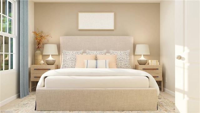 bedroom featuring light carpet and baseboards