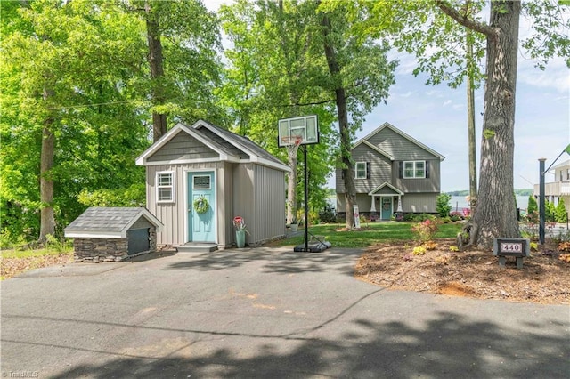 440 Sportsman Dr, Salisbury, NC 28146 - view of front facade featuring board and batten siding, an outdoor structure, and a storage shed