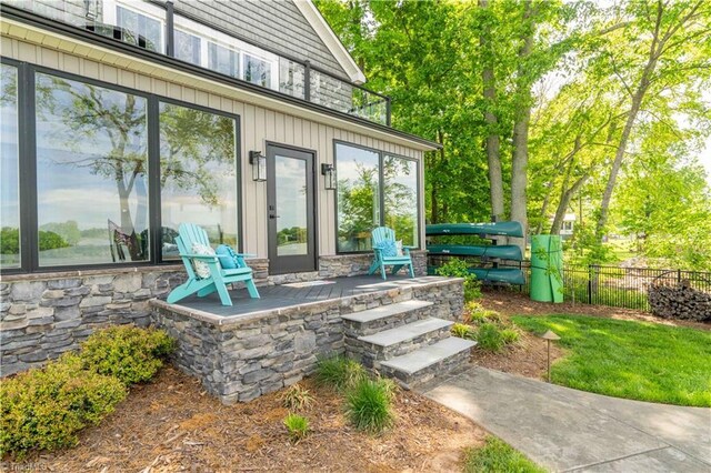 440 Sportsman Dr, Salisbury, NC 28146 - property entrance featuring fence and stone siding