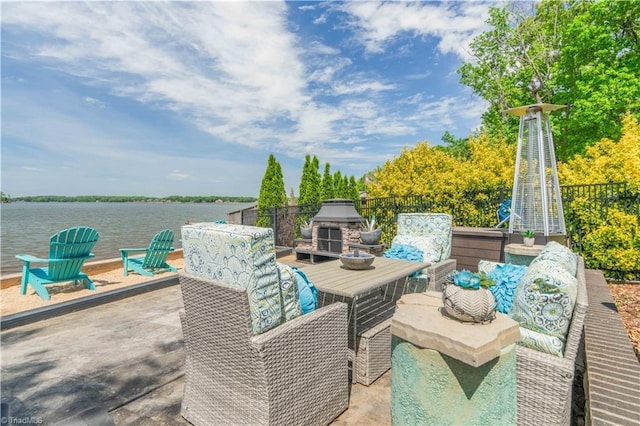 440 Sportsman Dr, Salisbury, NC 28146 - view of patio / terrace featuring a water view, an outdoor stone fireplace, and fence