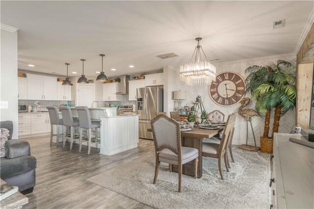 440 Sportsman Dr, Salisbury, NC 28146 - dining room with light wood finished floors, recessed lighting, a notable chandelier, and visible vents