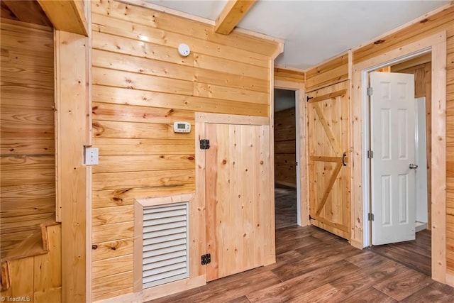 interior space featuring wood walls and dark hardwood / wood-style floors