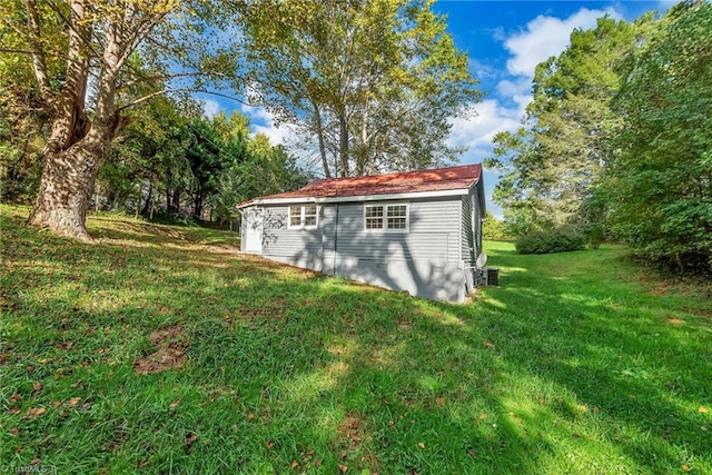 view of outdoor structure with a lawn