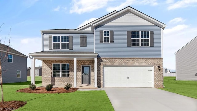 view of front of property featuring a garage and a front yard