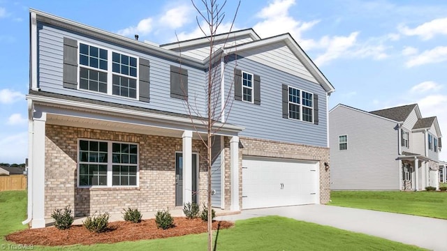 view of front of home featuring a garage and a front yard